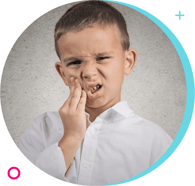 A young boy holding his nose and putting something in his mouth.