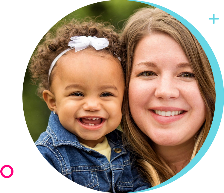 A woman and child smiling for the camera.