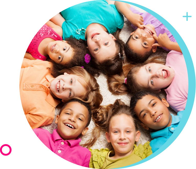 A group of children laying in the middle of each other